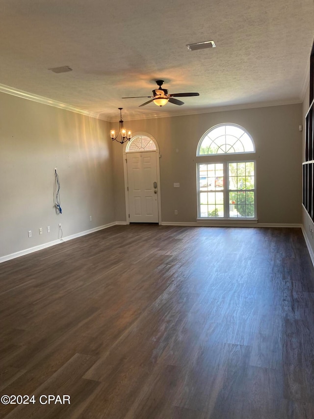 unfurnished living room featuring dark hardwood / wood-style floors, a textured ceiling, ceiling fan with notable chandelier, and ornamental molding