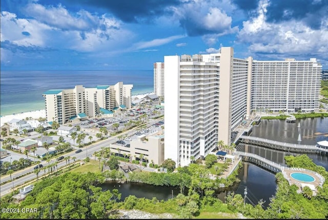 birds eye view of property featuring a view of city and a water view