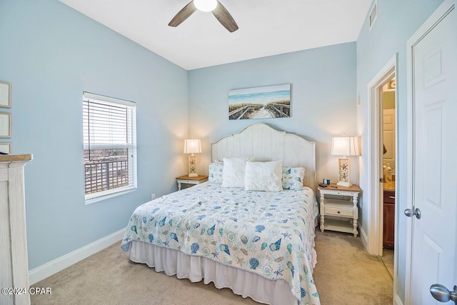 carpeted bedroom featuring visible vents, a ceiling fan, and baseboards