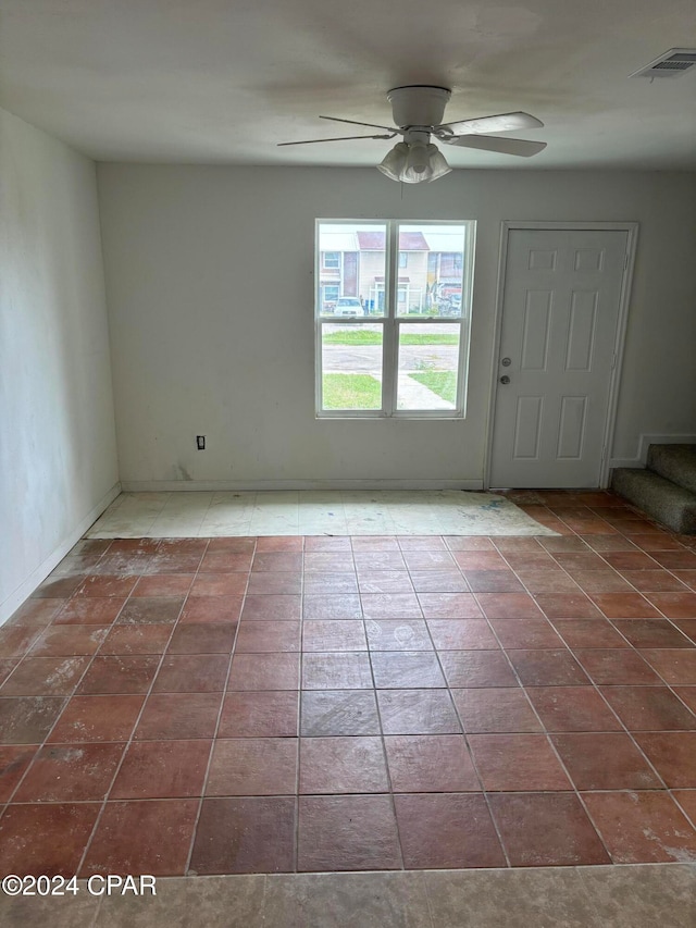 spare room featuring ceiling fan