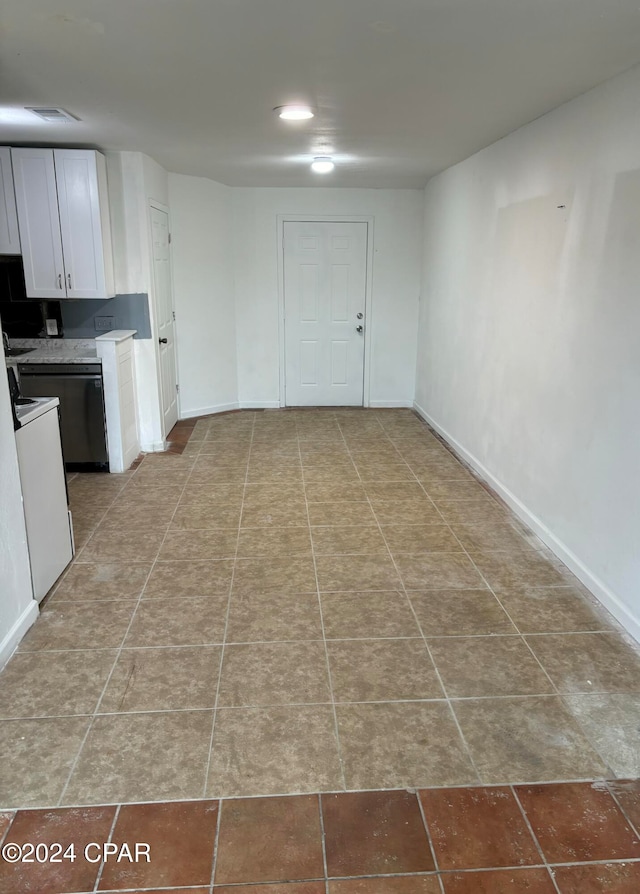 kitchen with white cabinetry and dishwashing machine