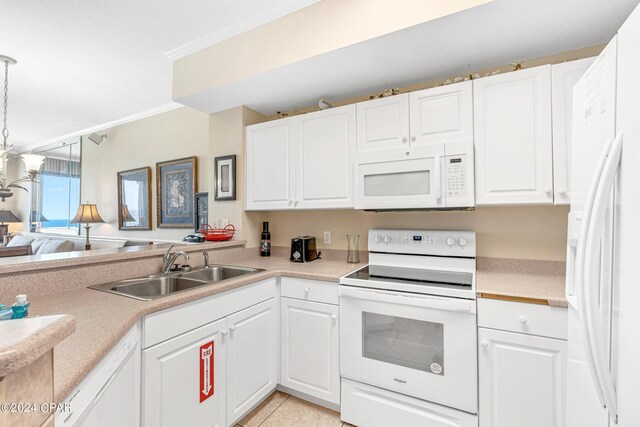 kitchen with white appliances and white cabinets