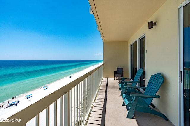 balcony with a view of the beach and a water view