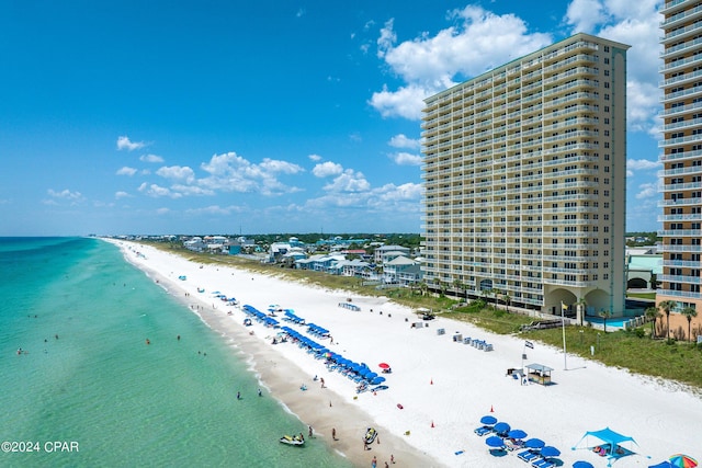 aerial view with a water view, a city view, and a beach view