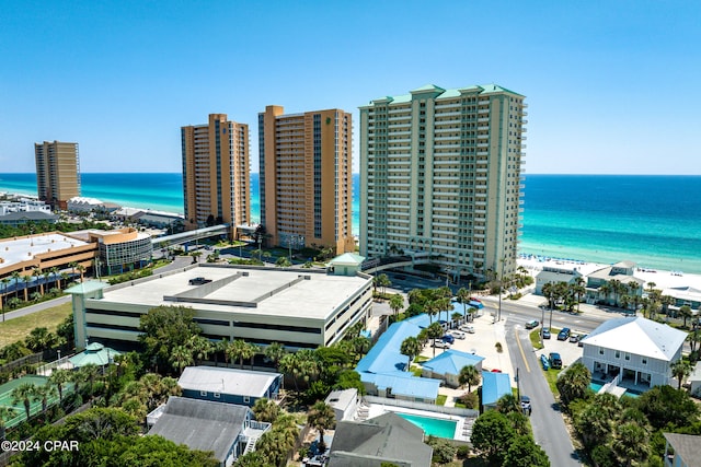 birds eye view of property featuring a view of the beach and a water view