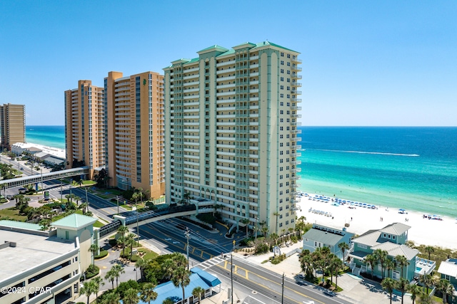 exterior space featuring a view of the beach and a water view