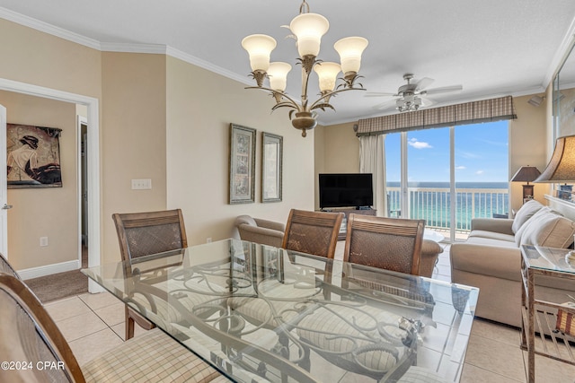 tiled dining space with ceiling fan with notable chandelier and ornamental molding