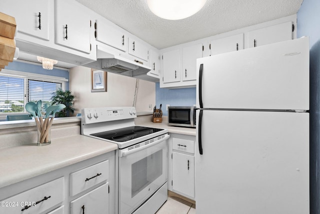 kitchen featuring white cabinets, white appliances, a textured ceiling, and light tile patterned floors