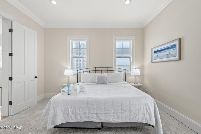 carpeted bedroom featuring ornamental molding