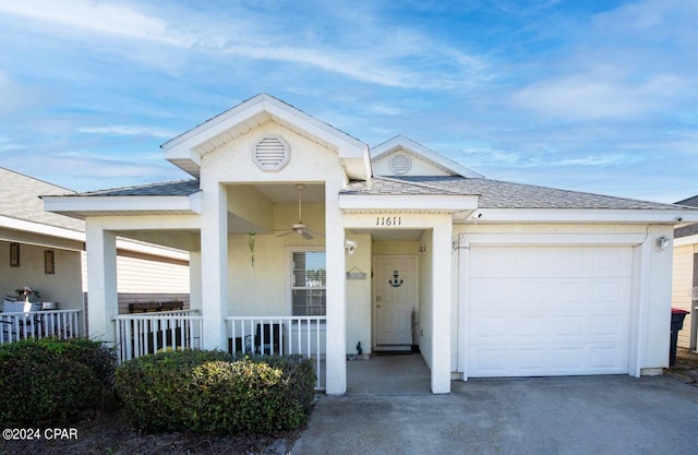 view of front of home with a garage and a porch