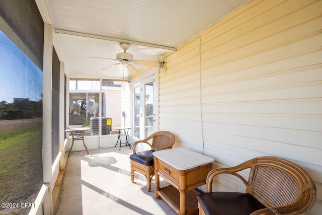 sunroom featuring ceiling fan