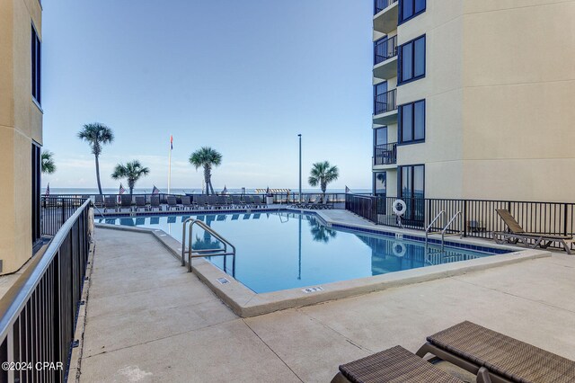 view of swimming pool with a patio