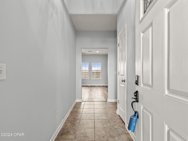 corridor with a textured ceiling