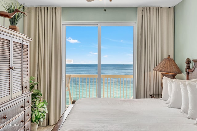 bedroom featuring a water view