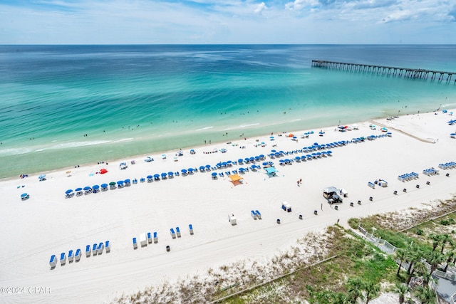 birds eye view of property featuring a view of the beach and a water view