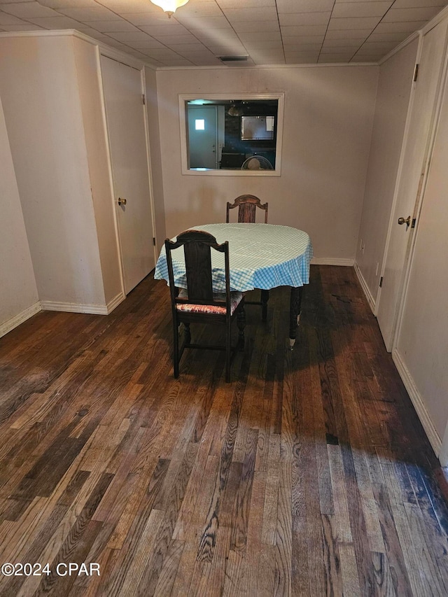 dining room with dark hardwood / wood-style flooring