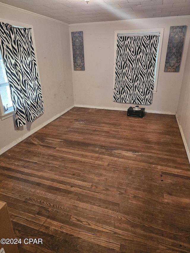 2510 W 18th St, Panama City, FL 32405 - spare room with wood finished floors, baseboards, and ornamental molding