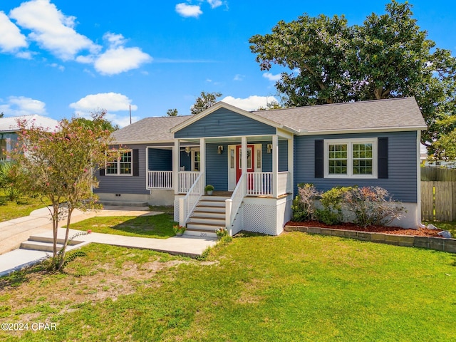 view of front of house featuring a front lawn and covered porch