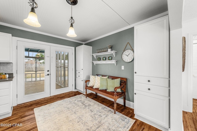 sitting room featuring crown molding, wood-type flooring, and french doors