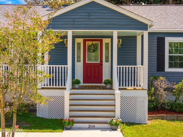 doorway to property with a porch