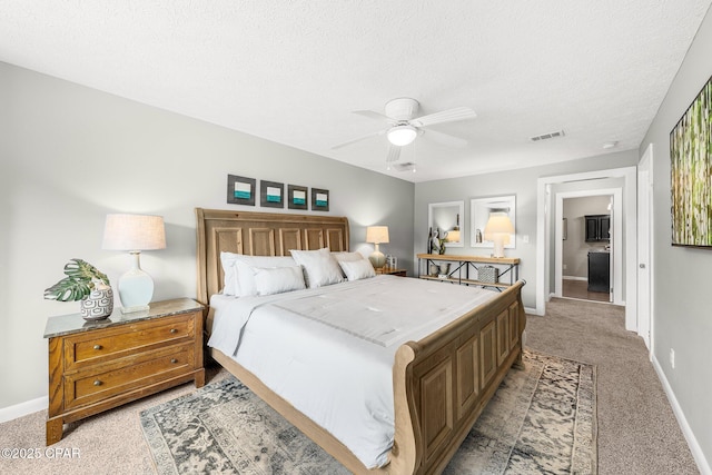 bedroom with light carpet, a textured ceiling, and ceiling fan