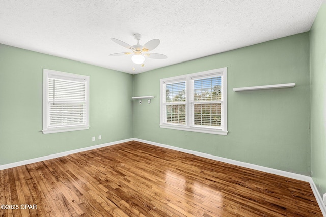 unfurnished room with hardwood / wood-style floors, a textured ceiling, and ceiling fan