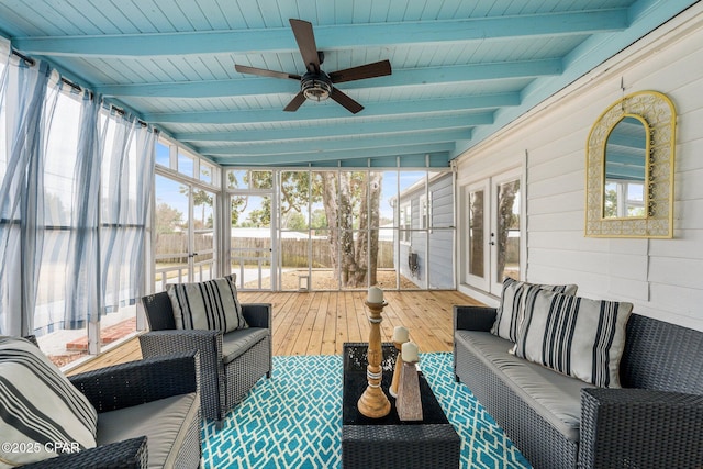 sunroom / solarium featuring ceiling fan, wooden ceiling, and beamed ceiling