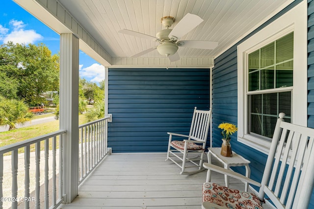 deck with covered porch and ceiling fan