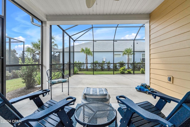 sunroom / solarium featuring a wealth of natural light and ceiling fan