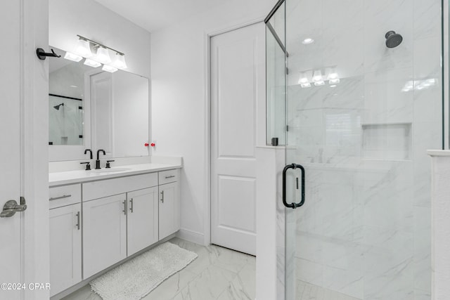 bathroom featuring walk in shower and vanity