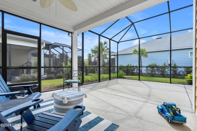 sunroom / solarium with ceiling fan and plenty of natural light