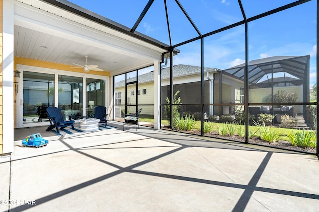 unfurnished sunroom featuring ceiling fan