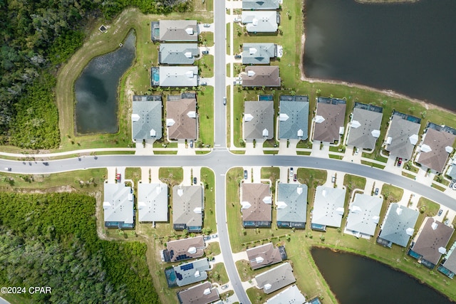 birds eye view of property featuring a water view