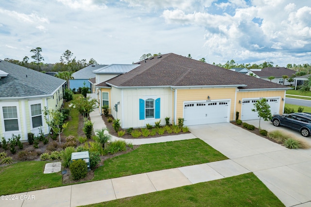 view of front facade with a garage and a front yard