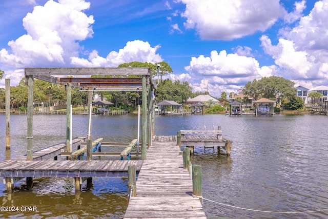 view of dock with a water view and boat lift