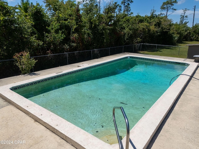 view of swimming pool with a fenced in pool and a fenced backyard