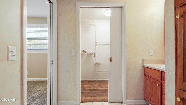 bathroom with vanity and hardwood / wood-style floors