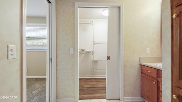 bathroom featuring vanity and baseboards