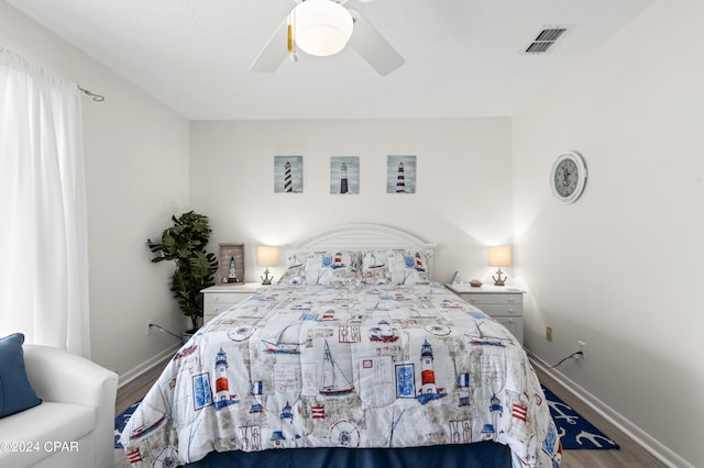 bedroom with ceiling fan and hardwood / wood-style floors