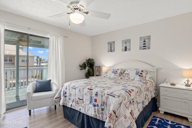 bedroom featuring access to exterior, ceiling fan, and light hardwood / wood-style flooring