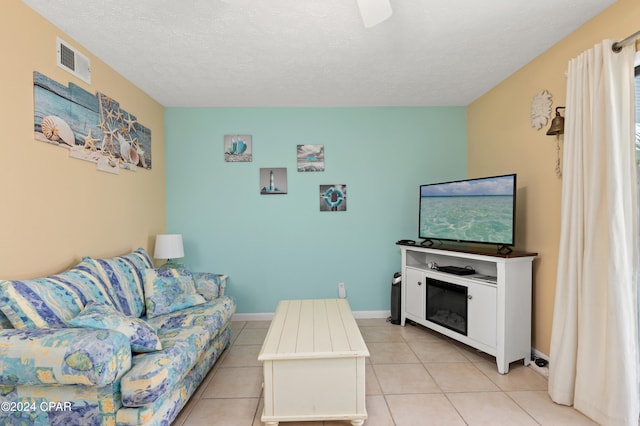 tiled living room with a textured ceiling