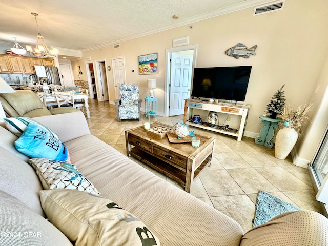 tiled living room featuring a chandelier, crown molding, and a textured ceiling