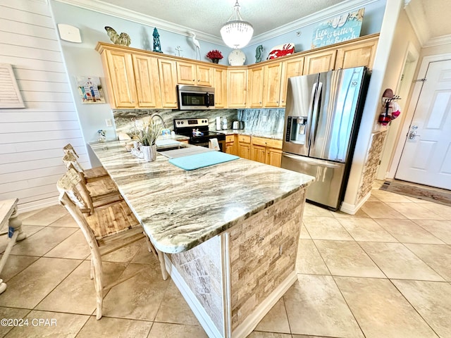 kitchen with stainless steel appliances, ornamental molding, decorative light fixtures, and kitchen peninsula