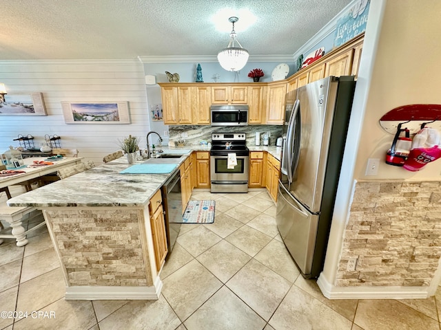 kitchen with crown molding, a textured ceiling, stainless steel appliances, decorative light fixtures, and light stone counters