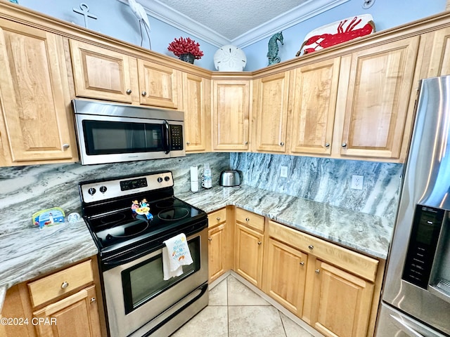 kitchen featuring ornamental molding, appliances with stainless steel finishes, tasteful backsplash, and light stone countertops