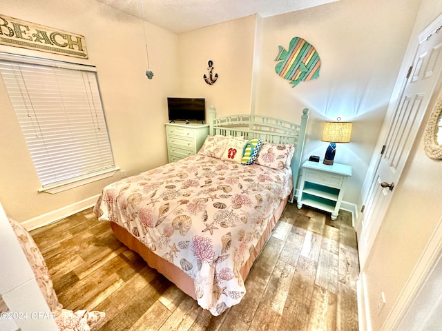 bedroom featuring wood-type flooring