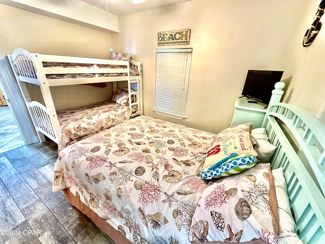 bedroom with dark hardwood / wood-style floors