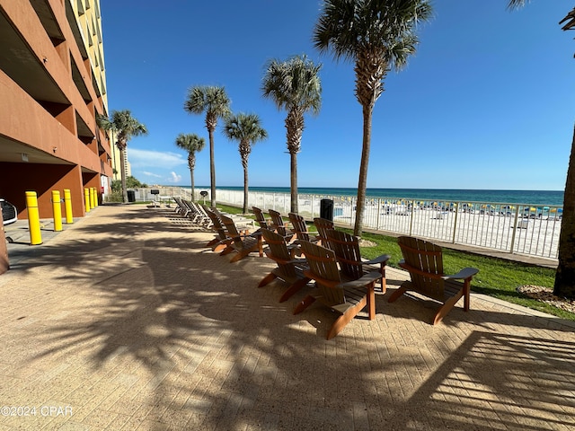 exterior space featuring a view of the beach and a water view