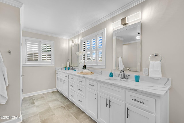 bathroom with a healthy amount of sunlight, ornamental molding, and vanity