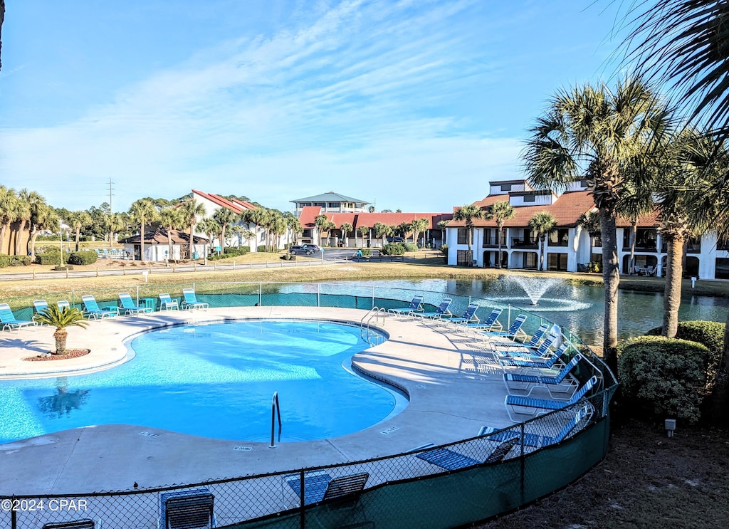 view of swimming pool with a water view